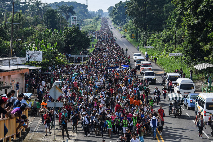 Honduran migrants take part in a caravan heading to the US, on the road linking Ciudad Hidalgo and Tapachula, Chiapas state, Mexico, on October 21, 2018. – Thousands of Honduran migrants resumed their march toward the United States on Sunday from the southern Mexican city of Ciudad Hidalgo, AFP journalists at the scene said. (Photo by Pedro Pardo / AFP) (Photo credit should read PEDRO PARDO/AFP/Getty Images)