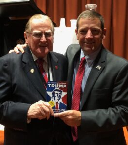 Ed Martin presents "The Conservative Case for Trump" book to Rev. Fred Nile 2017