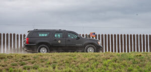 Photo: President Joe Biden's motorcade drives along the U.S.-Mexico border on the way to the Brownsville Border Patrol Station in Brownsville, Texas on February 29, 2024, cropped; public domain